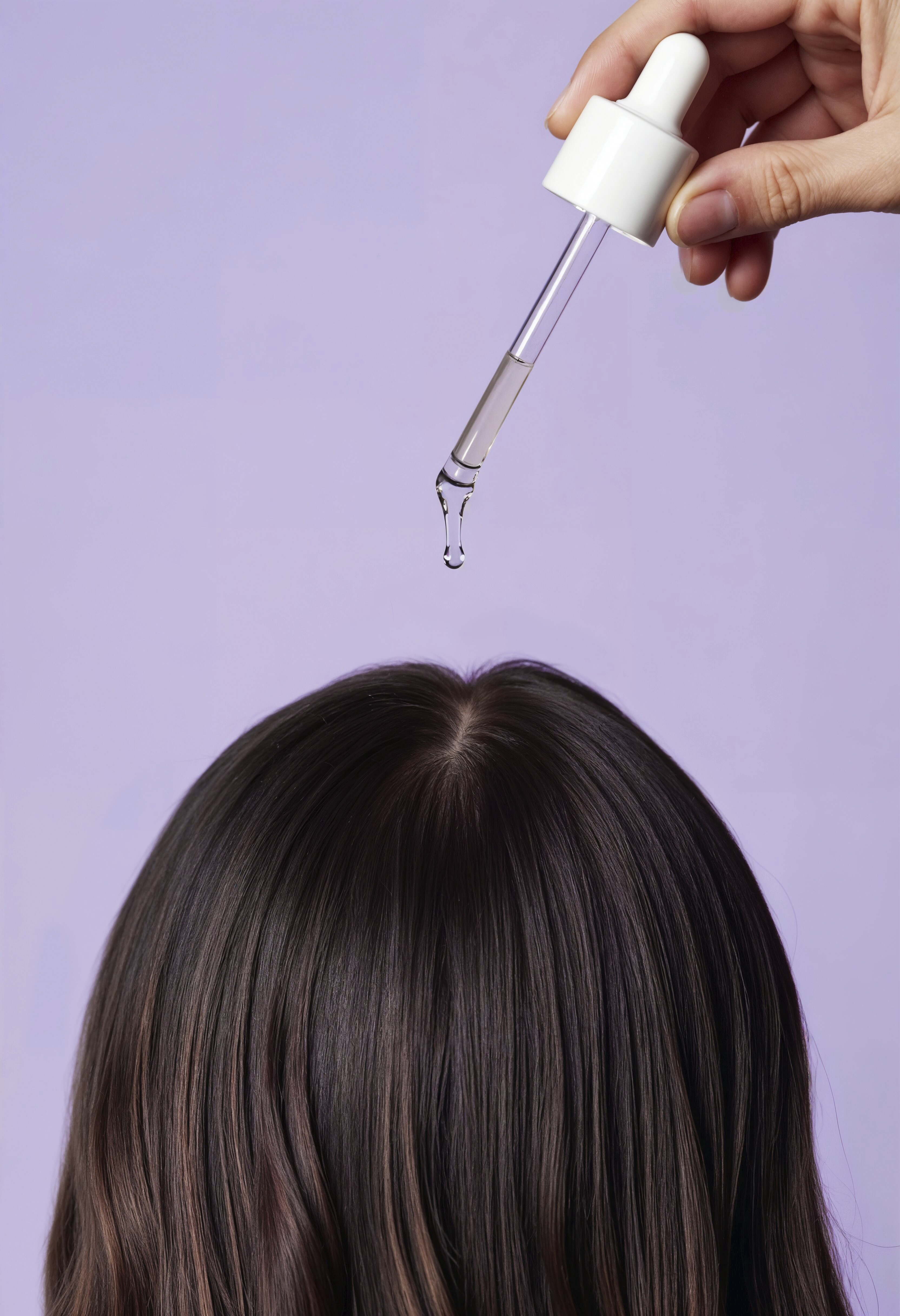 applying-serum-hair-with-dropper.jpeg